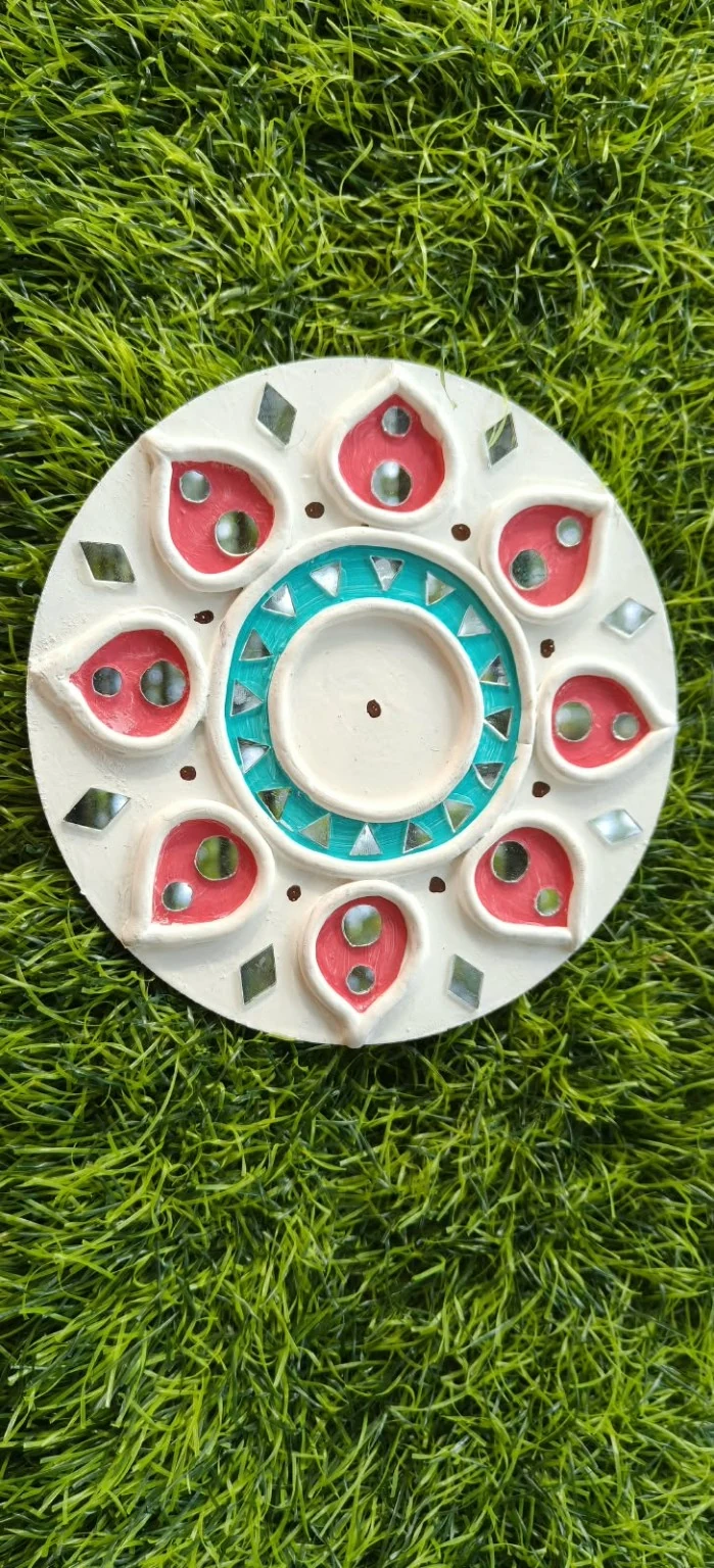 Handmade circular Lippan art, coral & turquoise design