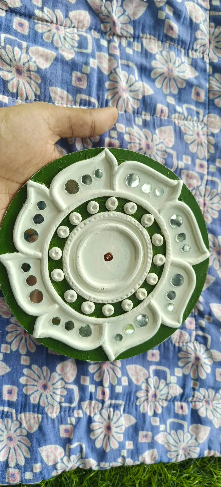 Handmade circular Lippan art, green petals design
