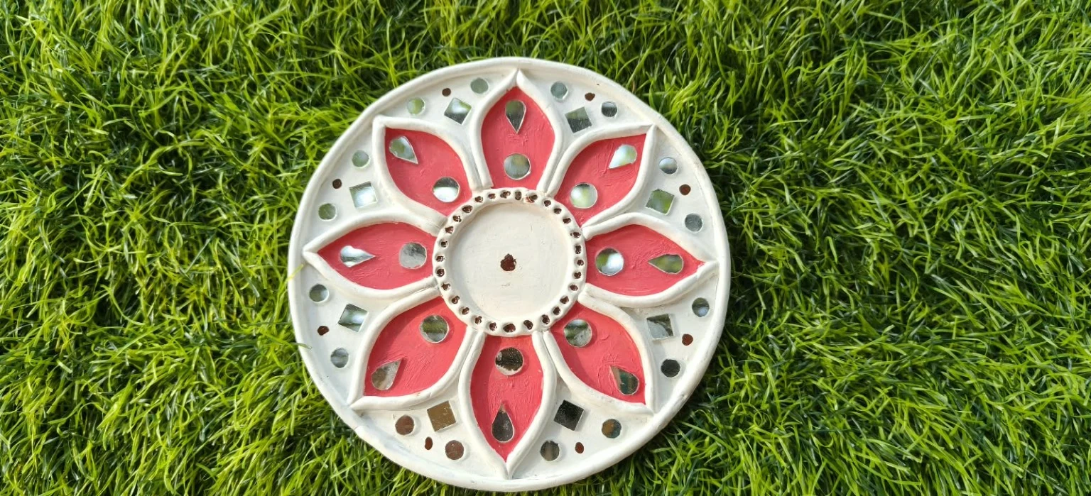 Handmade circular Lippan art, red floral design