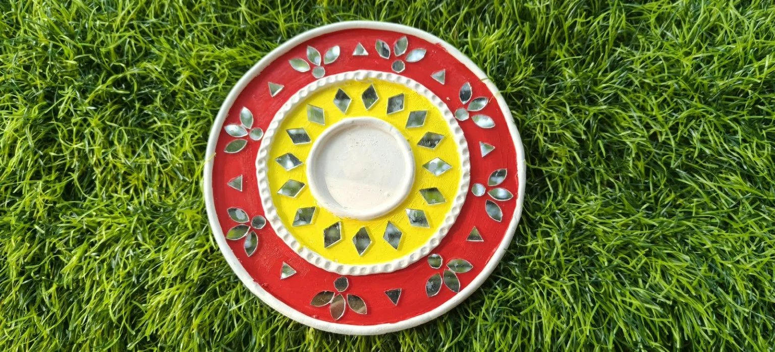 Handmade circular Lippan art, red & yellow design